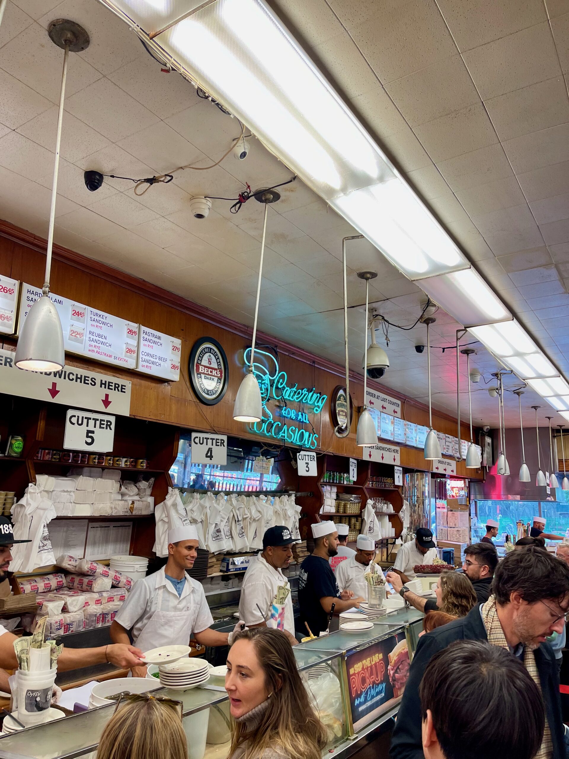 Busy sandwich counter inside Katz's Delicatessen in New York.