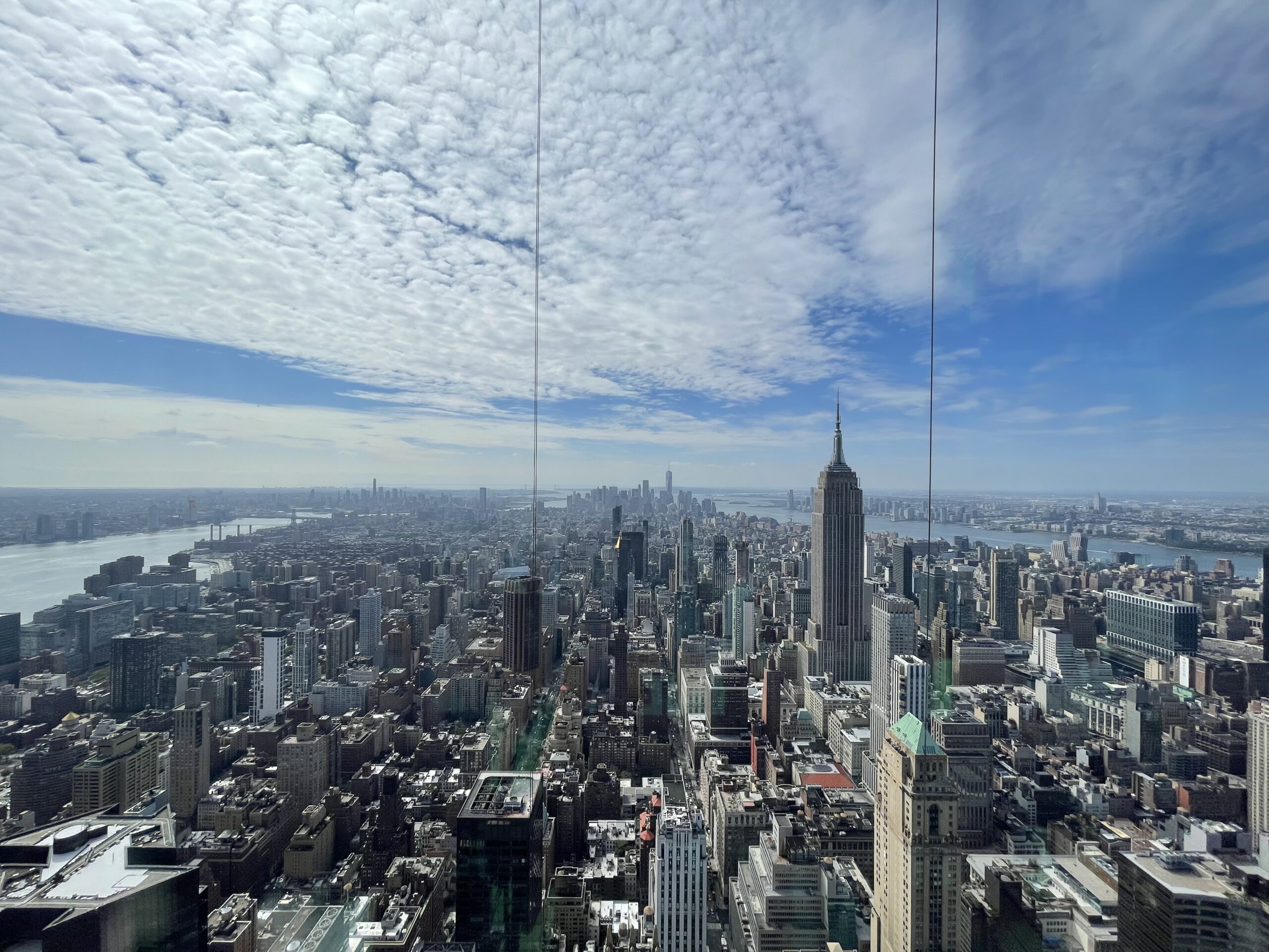Daytime view from SUMMIT One Vanderbilt across Midtown toward the Empire State Building.