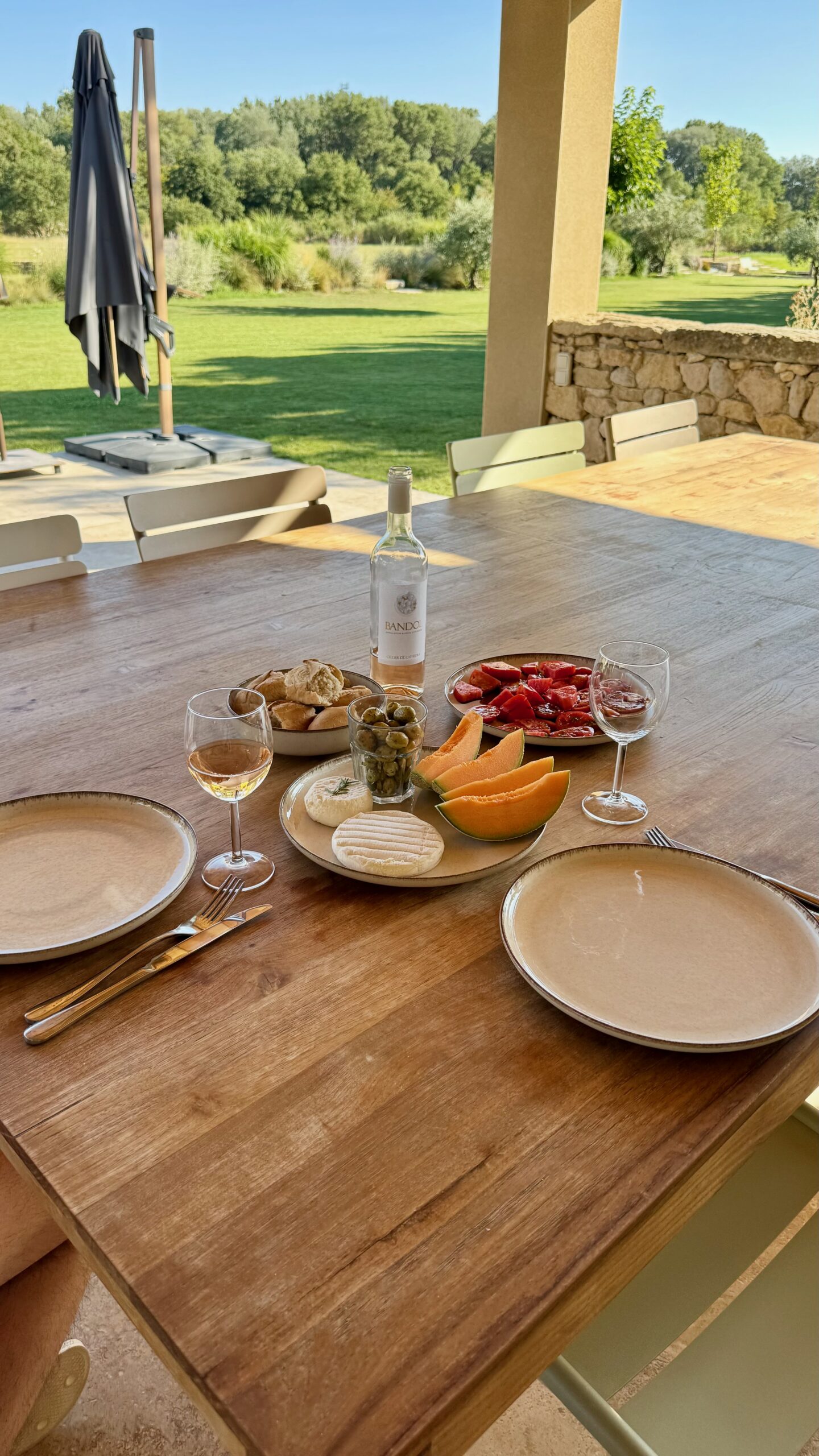 Cheese, melon and ham laid out by the pool at Terres Élaïs